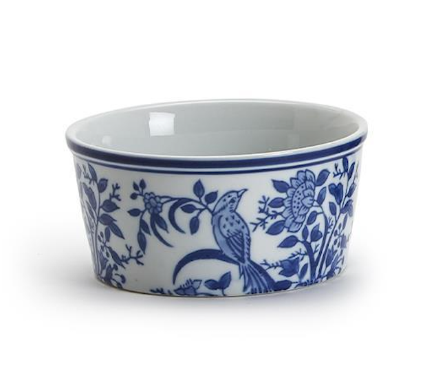 Ceramic bowl with blue floral and bird pattern on a white background