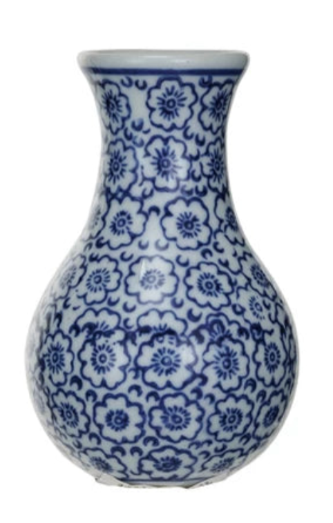 Ceramic vase with blue floral pattern on a white background
