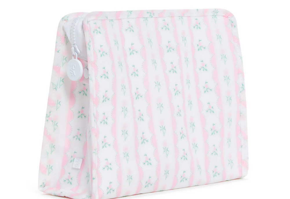 Pink and white striped cushion with floral pattern on a white background