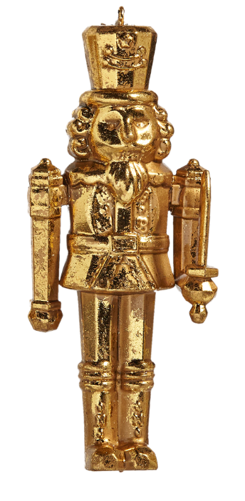 Gold nutcracker figurine on a white background