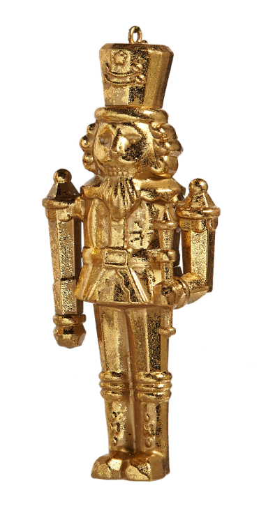 Gold nutcracker ornament on a white background