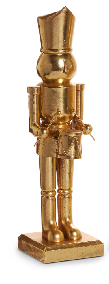 Gold nutcracker figurine on a white background