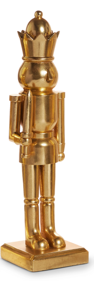 Gold nutcracker figurine on a white background