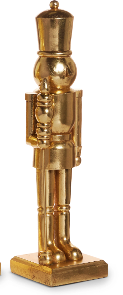 Gold nutcracker figurine on a white background