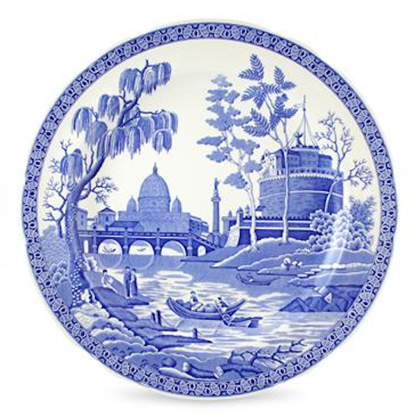 Decorative plate with blue and white scenic design on a white background