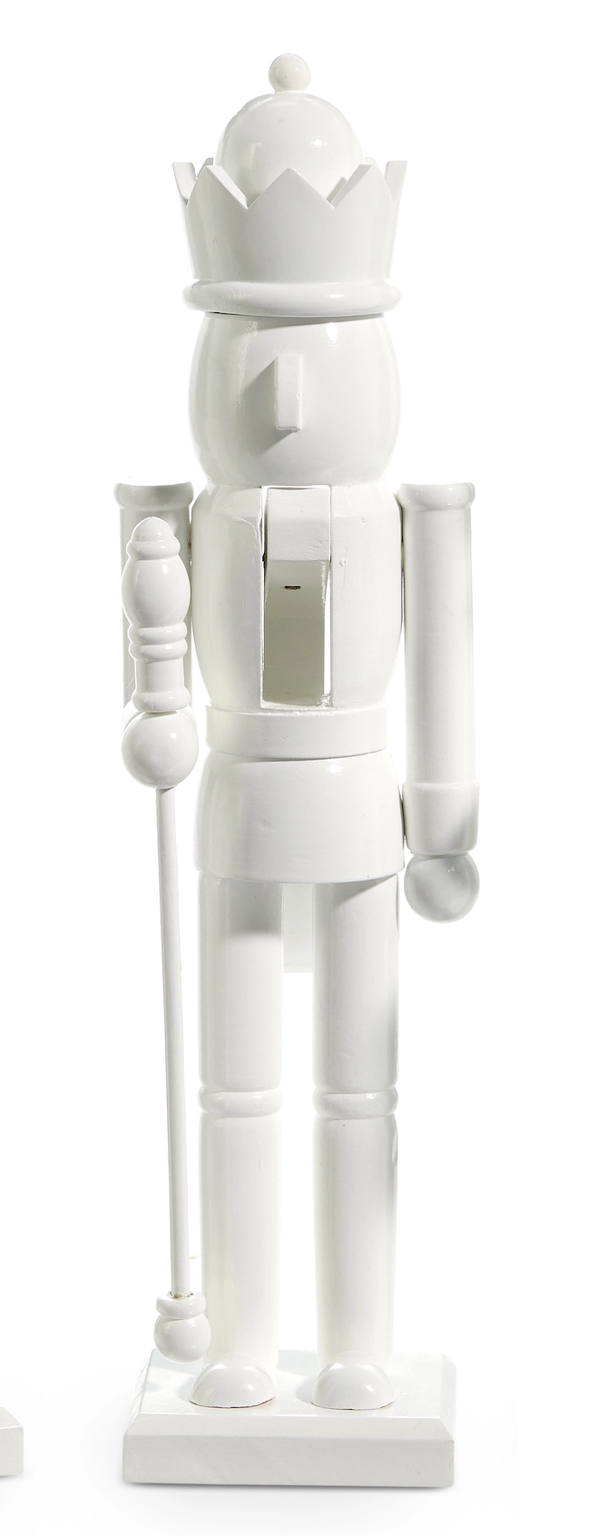 White nutcracker figurine with a crown on a white background