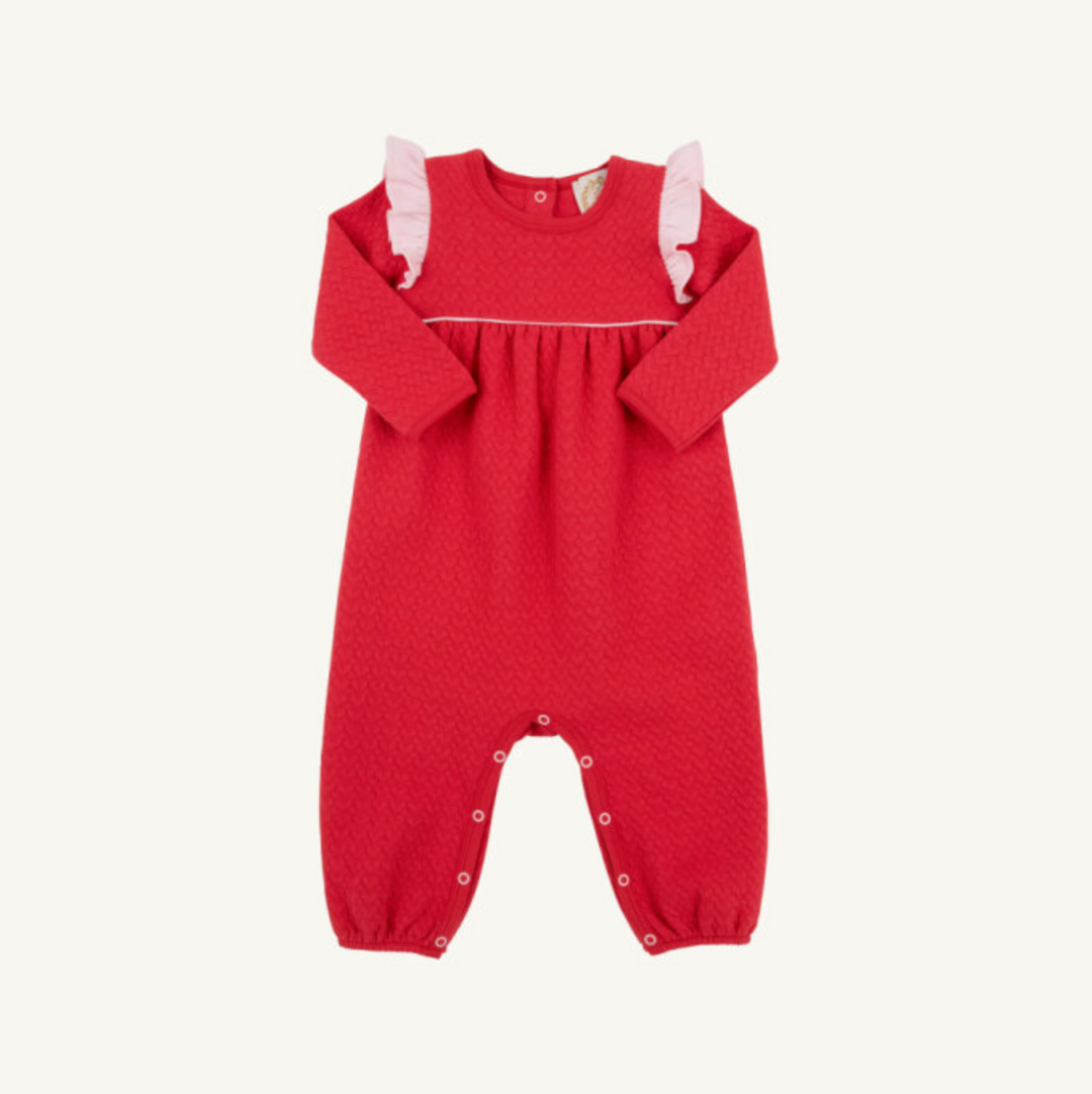 Red baby romper with white trim on a white background