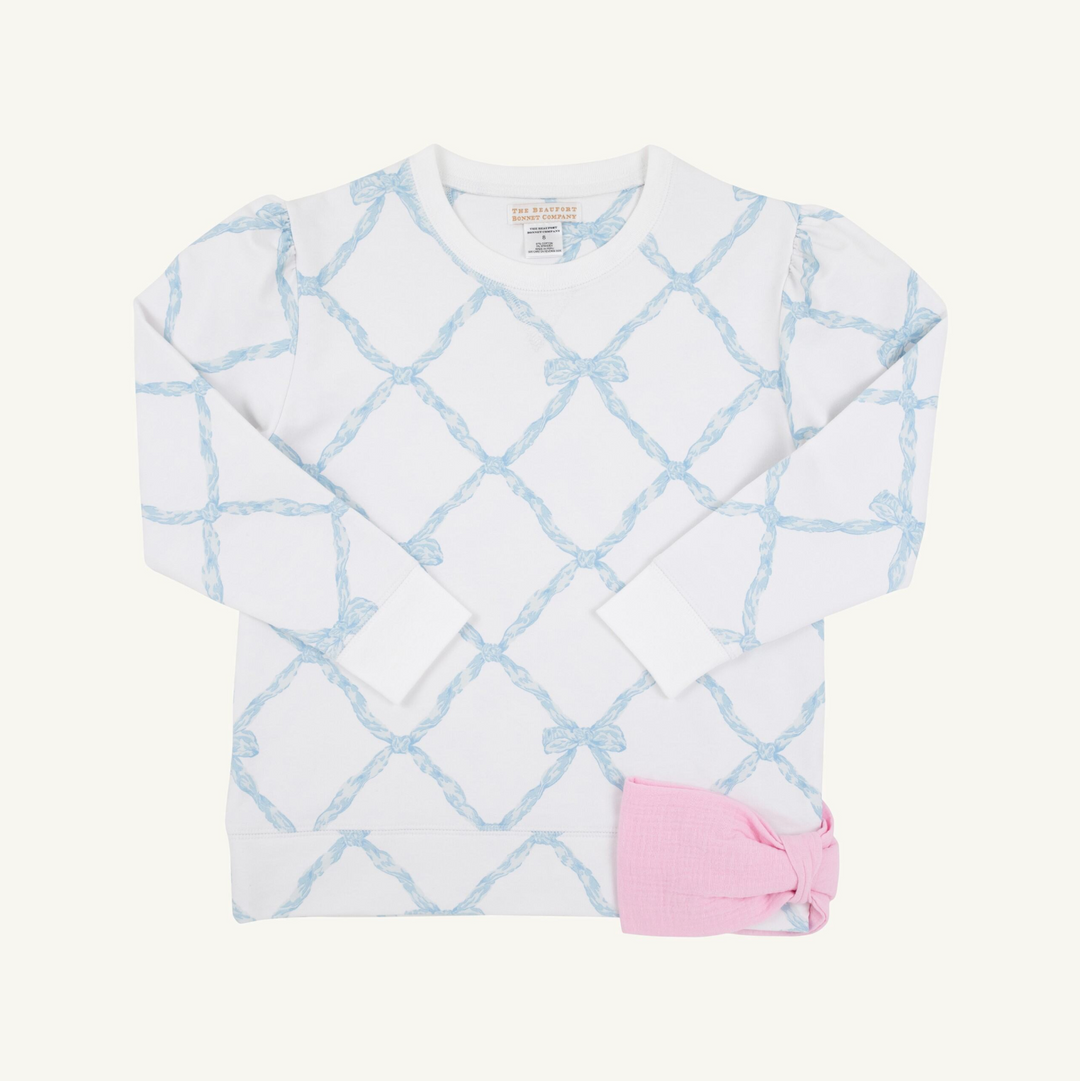 Baby outfit with white long-sleeve shirt and pink pants on a white background