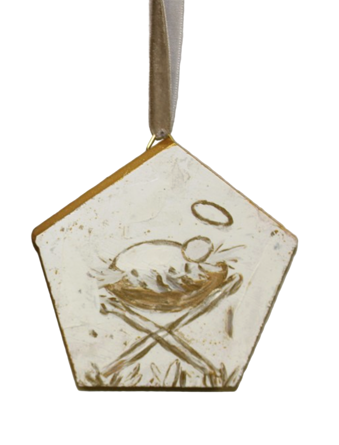 Hexagonal ceramic ornament with a nativity scene design on a plain background