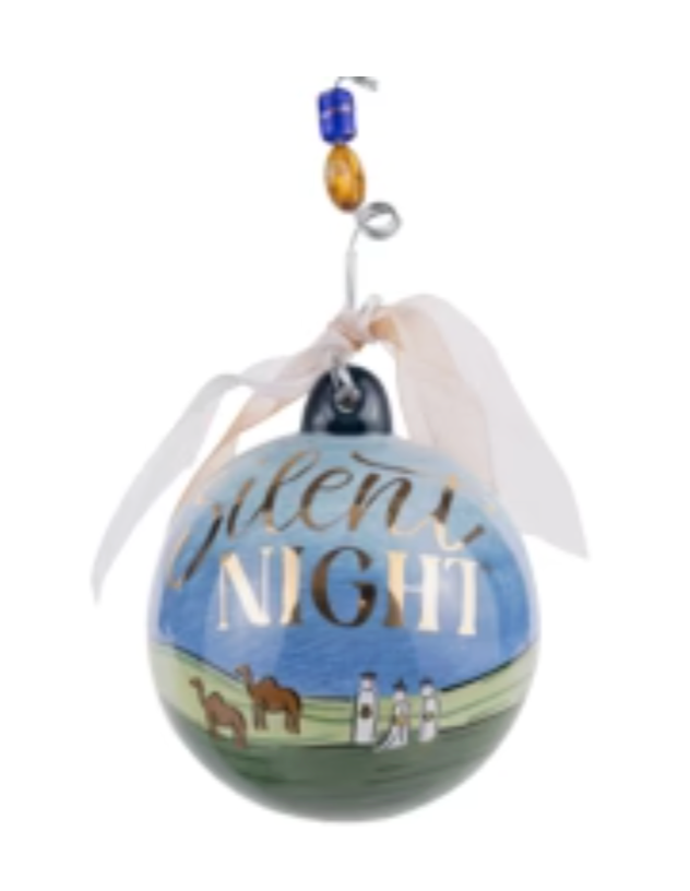Decorative ornament with 'Silent Night' text and Christmas scene on a white background