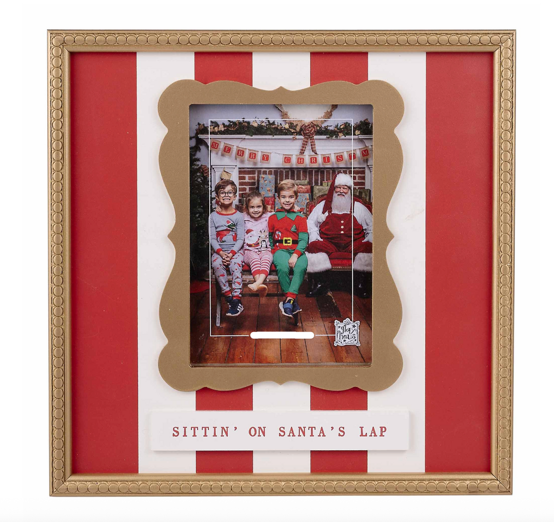 Decorative photo frame with red and white striped background and gold border, featuring a photo of children with Santa.