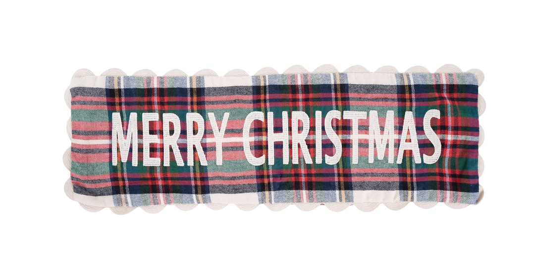 Plaid pillow with 'Merry Christmas' text on a white background