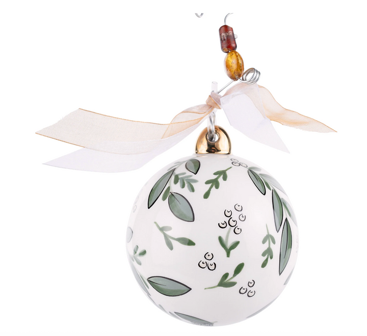 Decorative ornament with leaf pattern and ribbon on a white background