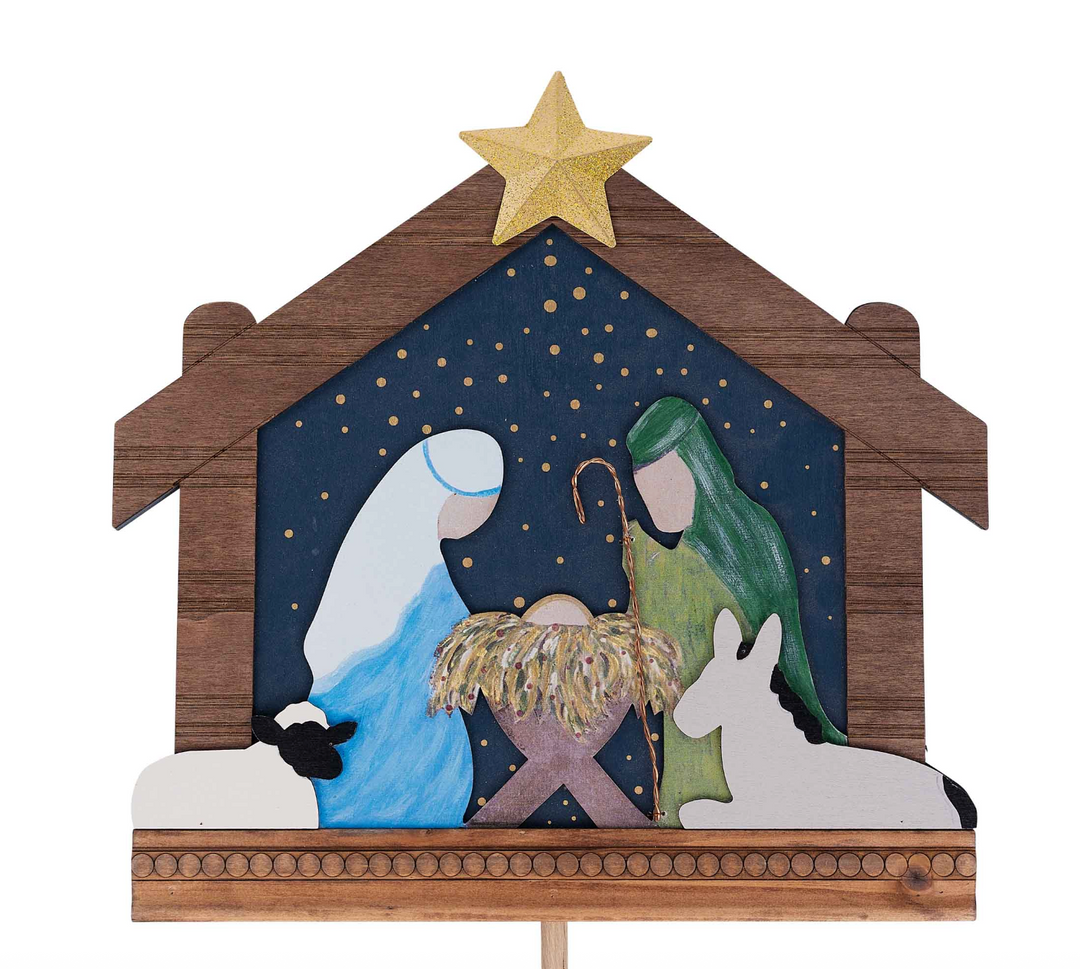 Decorative nativity scene with wooden stable, star, and figures on a white background