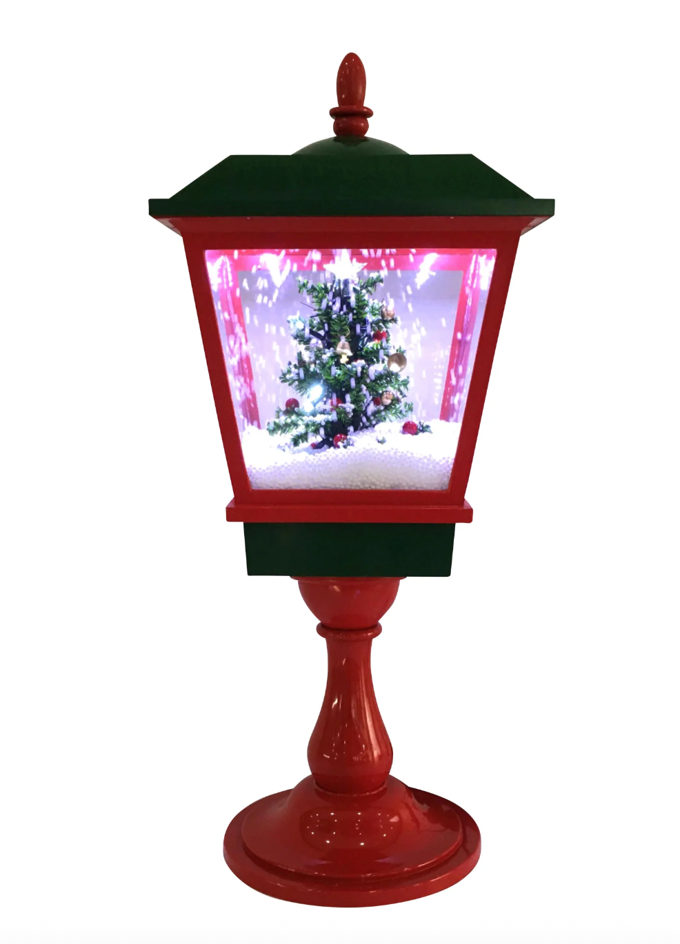 Decorative Christmas lamp with a tree and snow scene inside on a white background