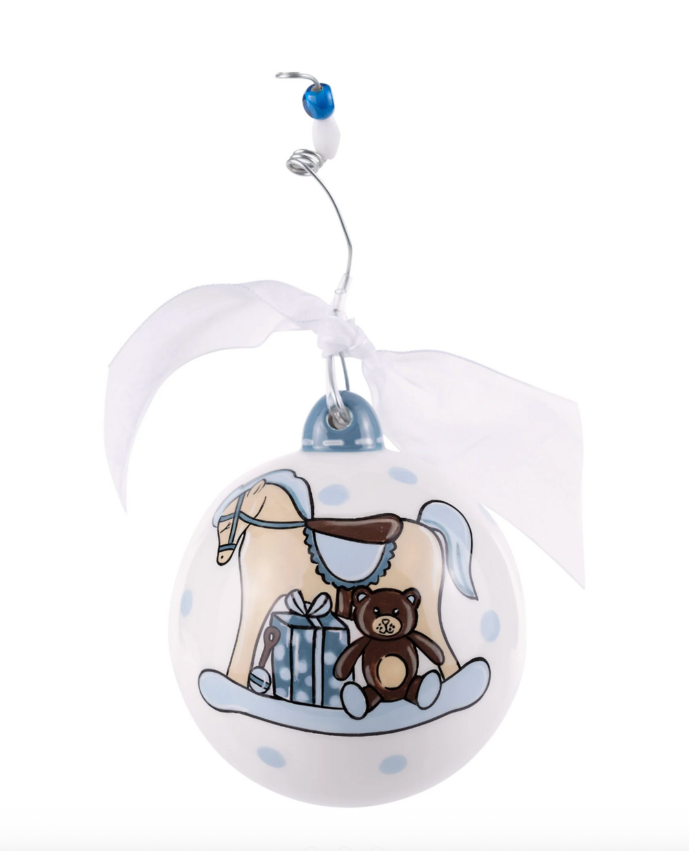 Decorative Christmas ball ornament with horse, saddle, and teddy bear design on a white background.