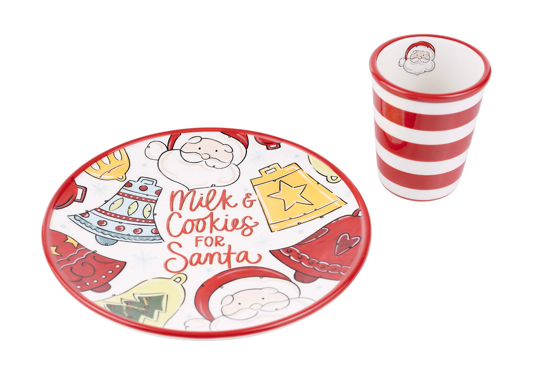 Christmas-themed plate and cup set with Santa Claus design on a white background