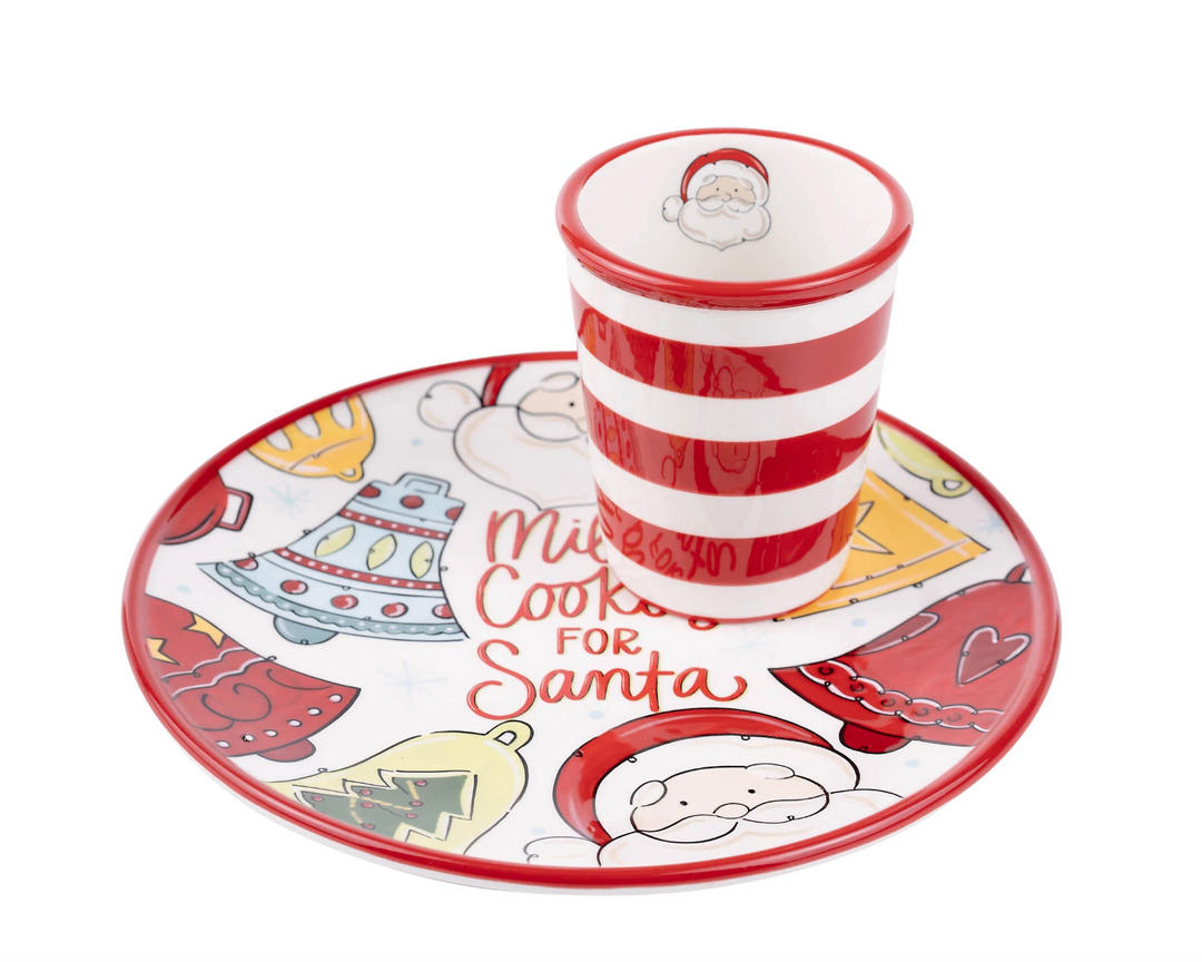 Ceramic cup and saucer set with Christmas-themed design on a white background