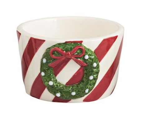 Decorative bowl with candy cane pattern and Christmas wreath design on a white background