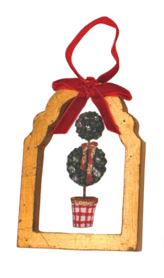 Decorative ornament with a wooden frame, topiary, and red ribbon on a white background