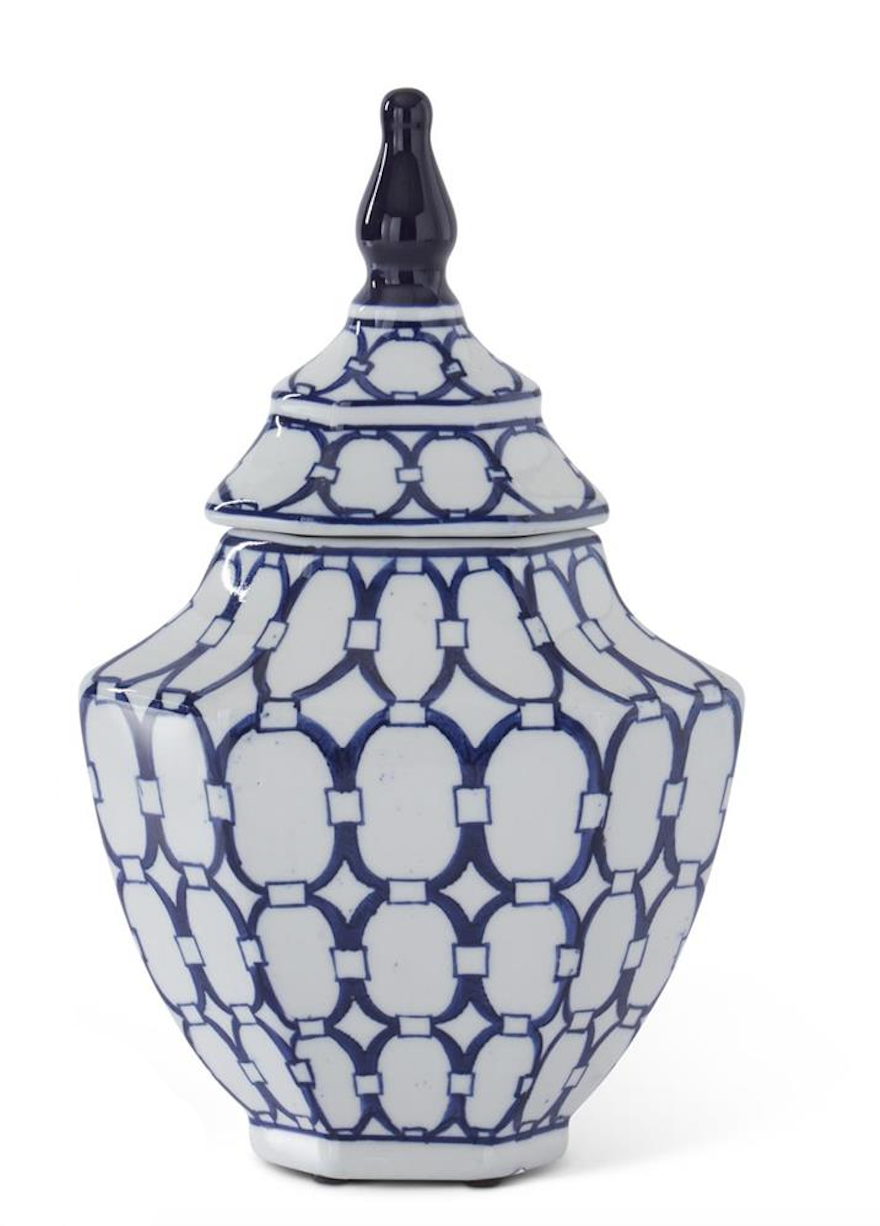Blue and white patterned vase with a lid on a white background