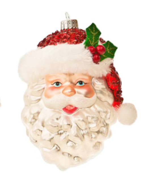 Christmas ornament of a Santa Claus face with a red hat and holly leaves on a white background