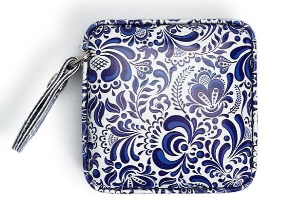 Blue and white floral patterned pouch on a white background