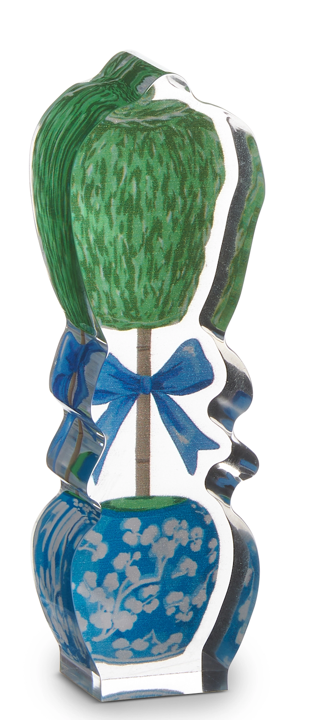 Decorative vase with a green topiary and blue ribbon on a white background