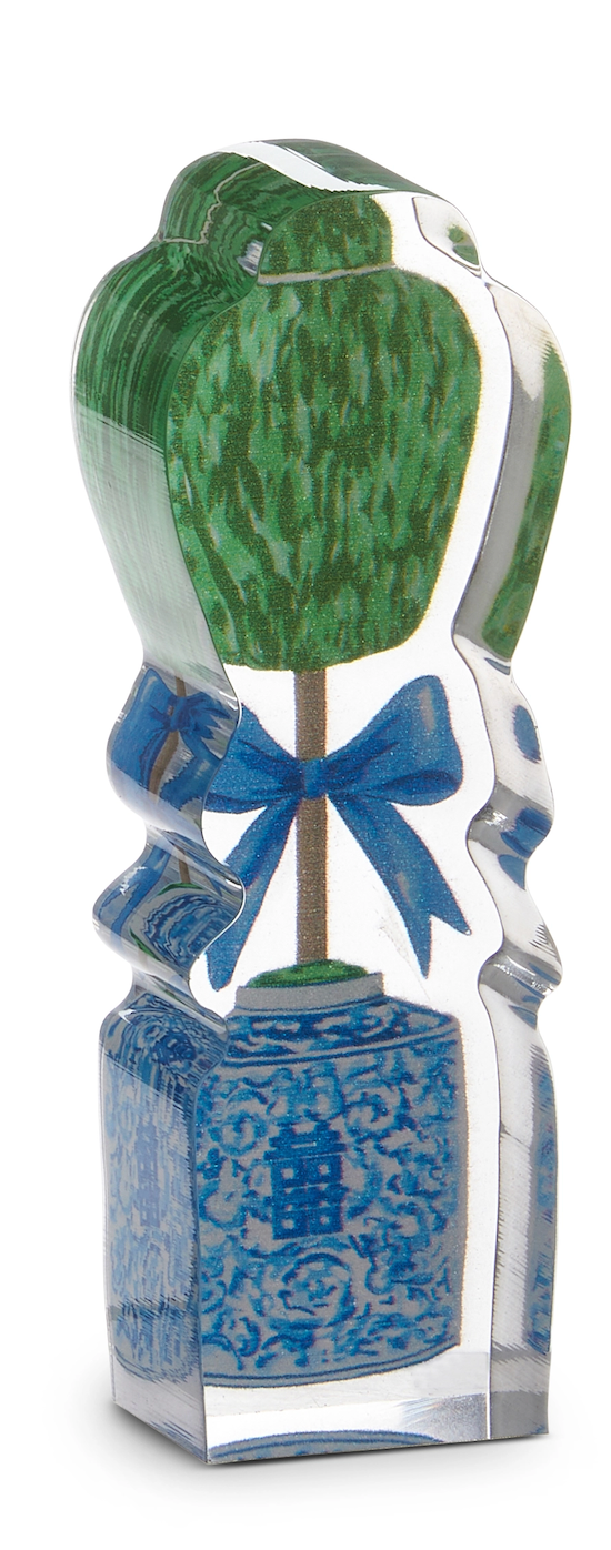Decorative item with green top, blue bow, and blue patterned base on a white background