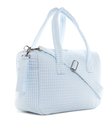 Light blue and white striped quilted duffle bag with top handles and zip closure | Walker Boutique