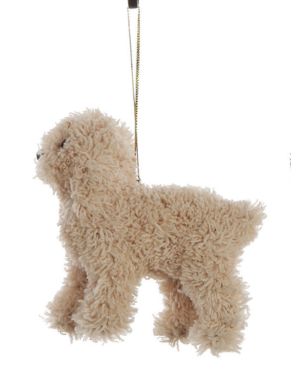 A fluffy beige dog-shaped hanging ornament with a gold hanging string, shown against a plain white background.