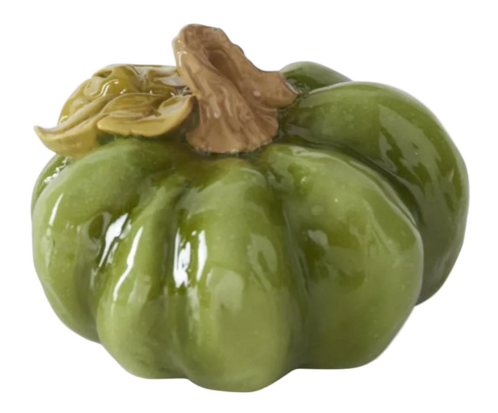 A glossy green ceramic pumpkin figurine with a textured brown stem and leaf detail, shown on a white background 