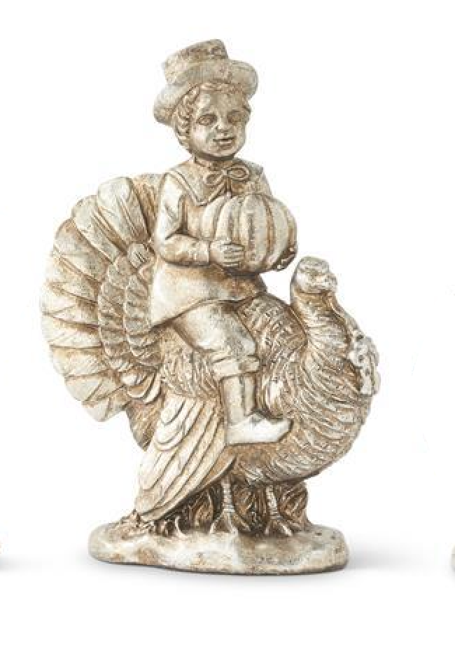 A small decorative figurine of a child riding a turkey, shown on a plain white background. The figurine has an antique silver or pewter finish.