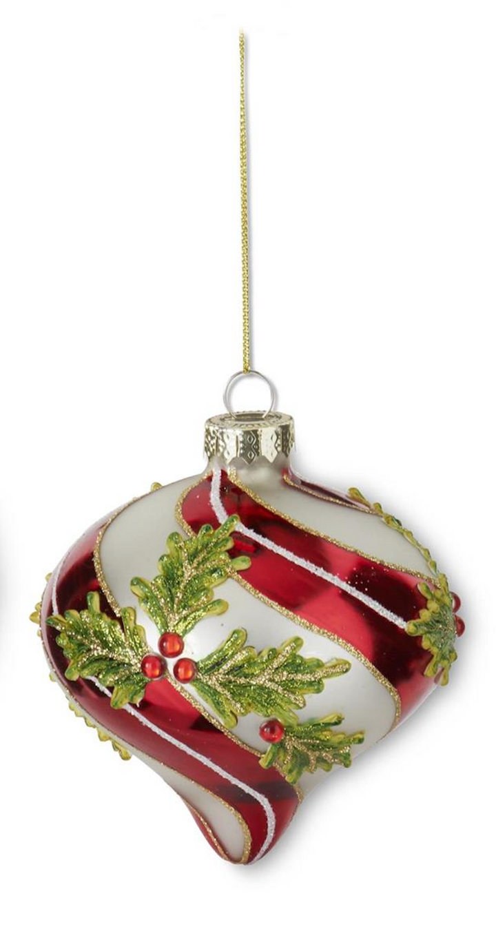 A Christmas ornament shaped like a teardrop, featuring glossy red and white swirls, green holly leaves, red berries, and gold glitter accents, hanging from a thin gold string against a white background.