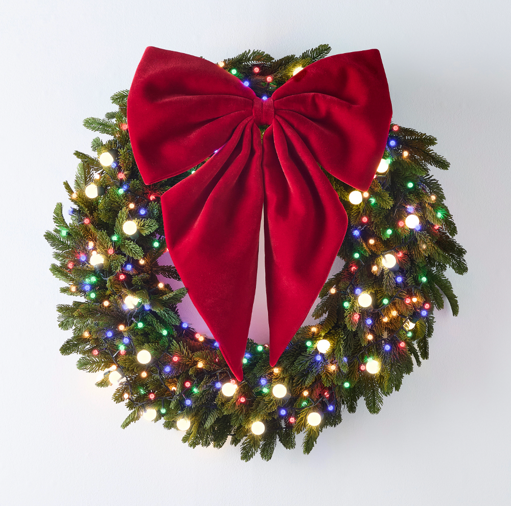 29" RED VELVET BOW ON LIT WREATH ON WHITE BACKGROUND