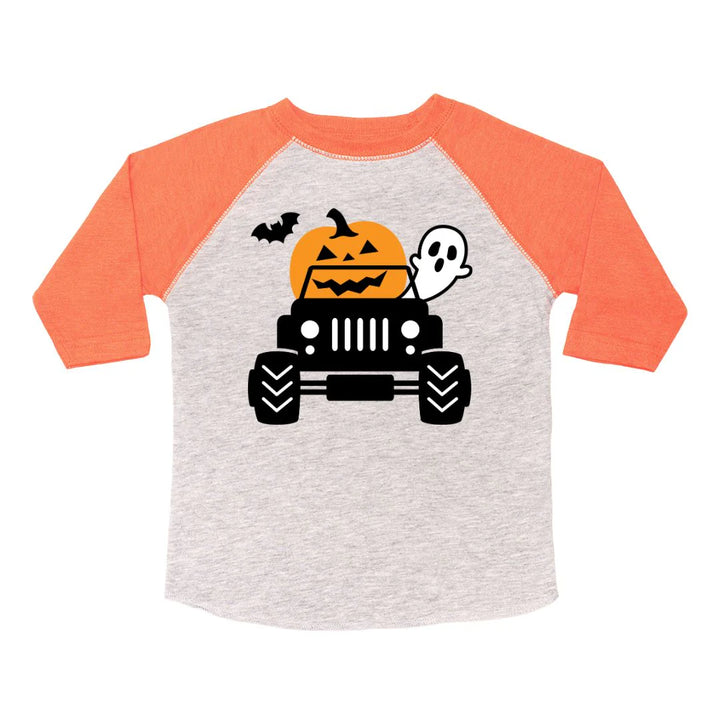 Children's Halloween-themed shirt with pumpkin, ghost, and Jeep graphic on a white background
