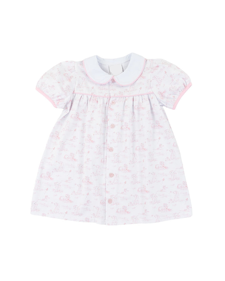 White dress with pink puppy pattern on a white background