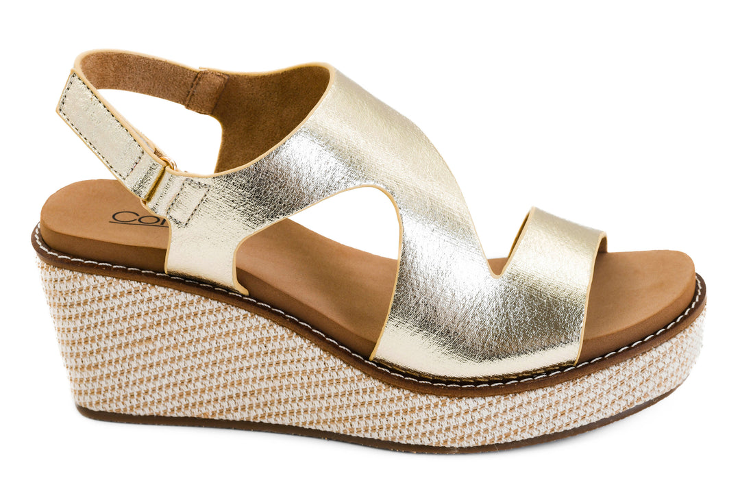 Metallic gold platform wedge sandals with adjustable slingback strap and woven espadrille-style wedge sole | Walker Boutique