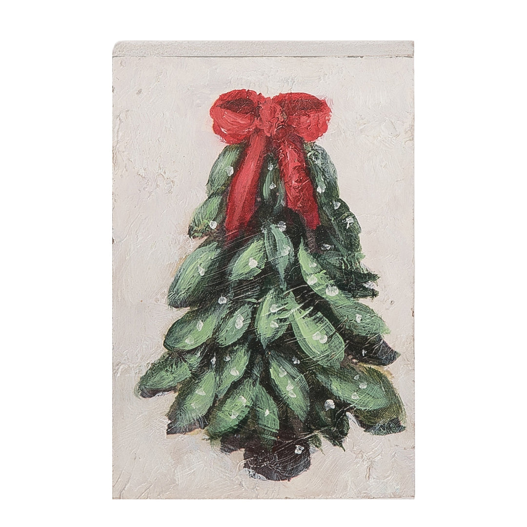 Decorative card with a green Christmas tree and red bow on a textured beige background