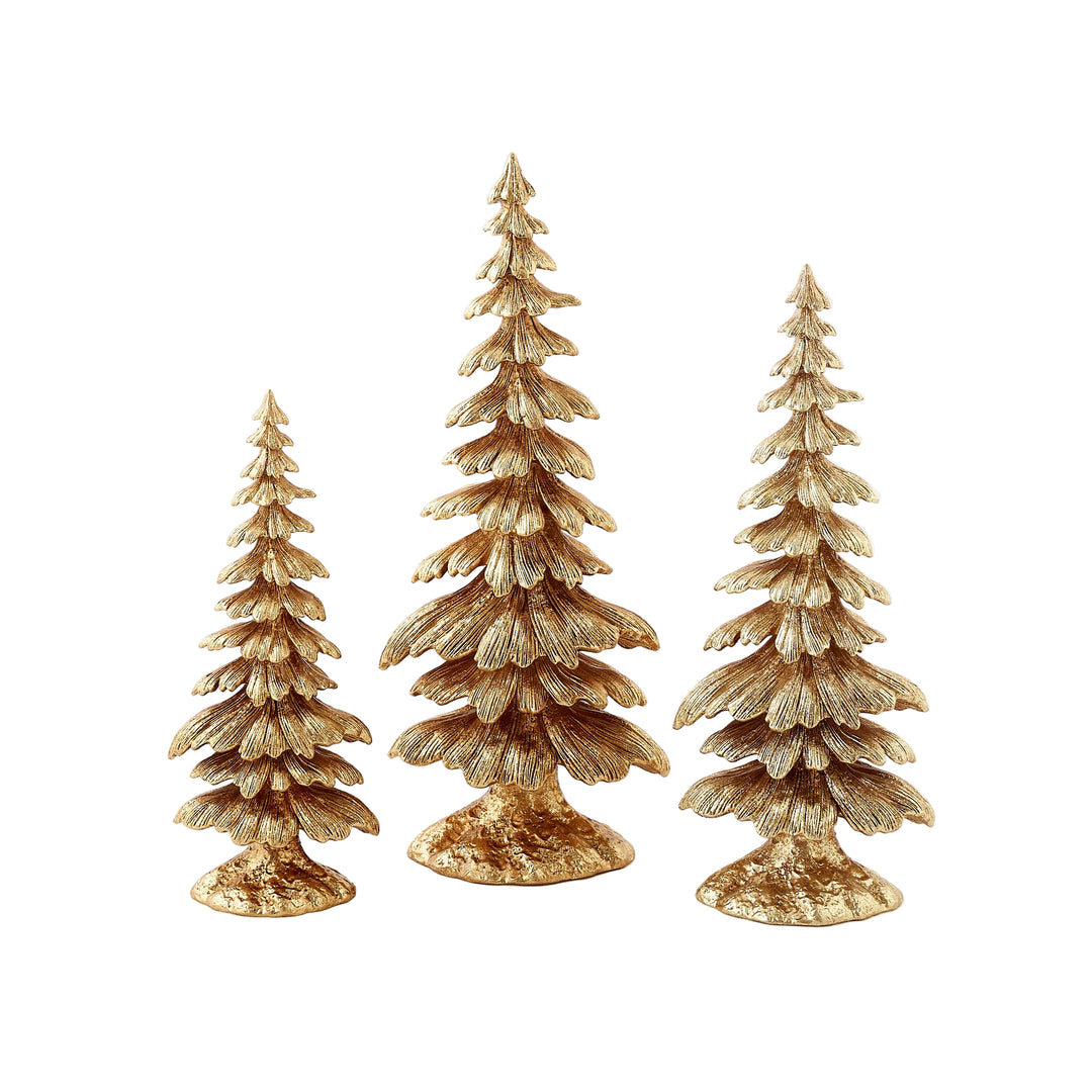 Three gold Christmas tree figurines on a white background