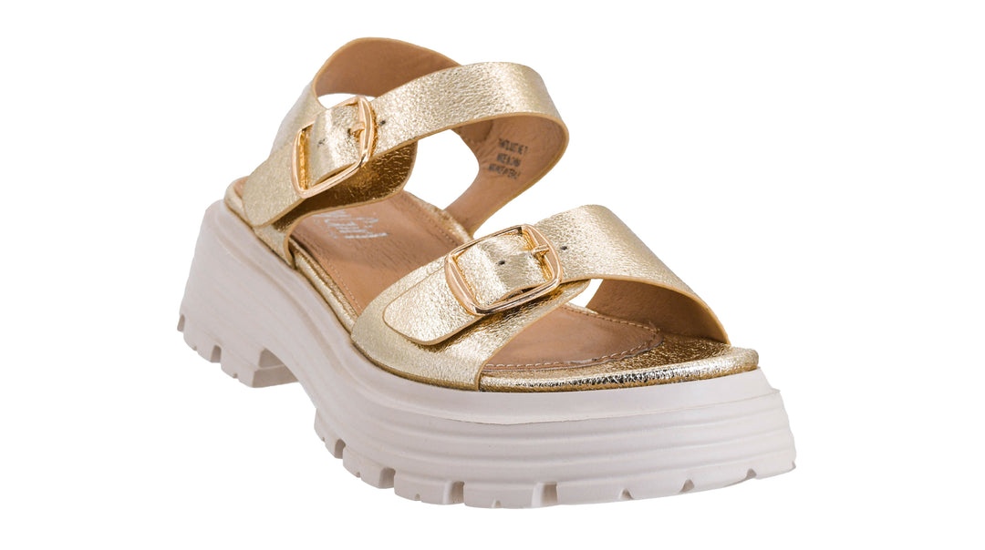 Gold platform sandals on a white background