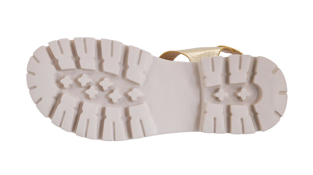 White sole of a shoe with tread pattern on a white background