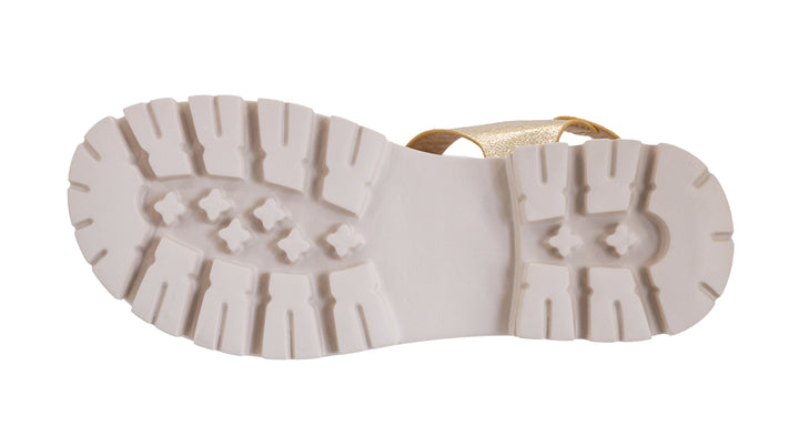 White sole of a shoe with tread pattern on a white background