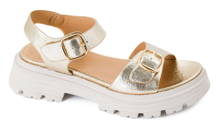 Gold sandal with white sole on a white background