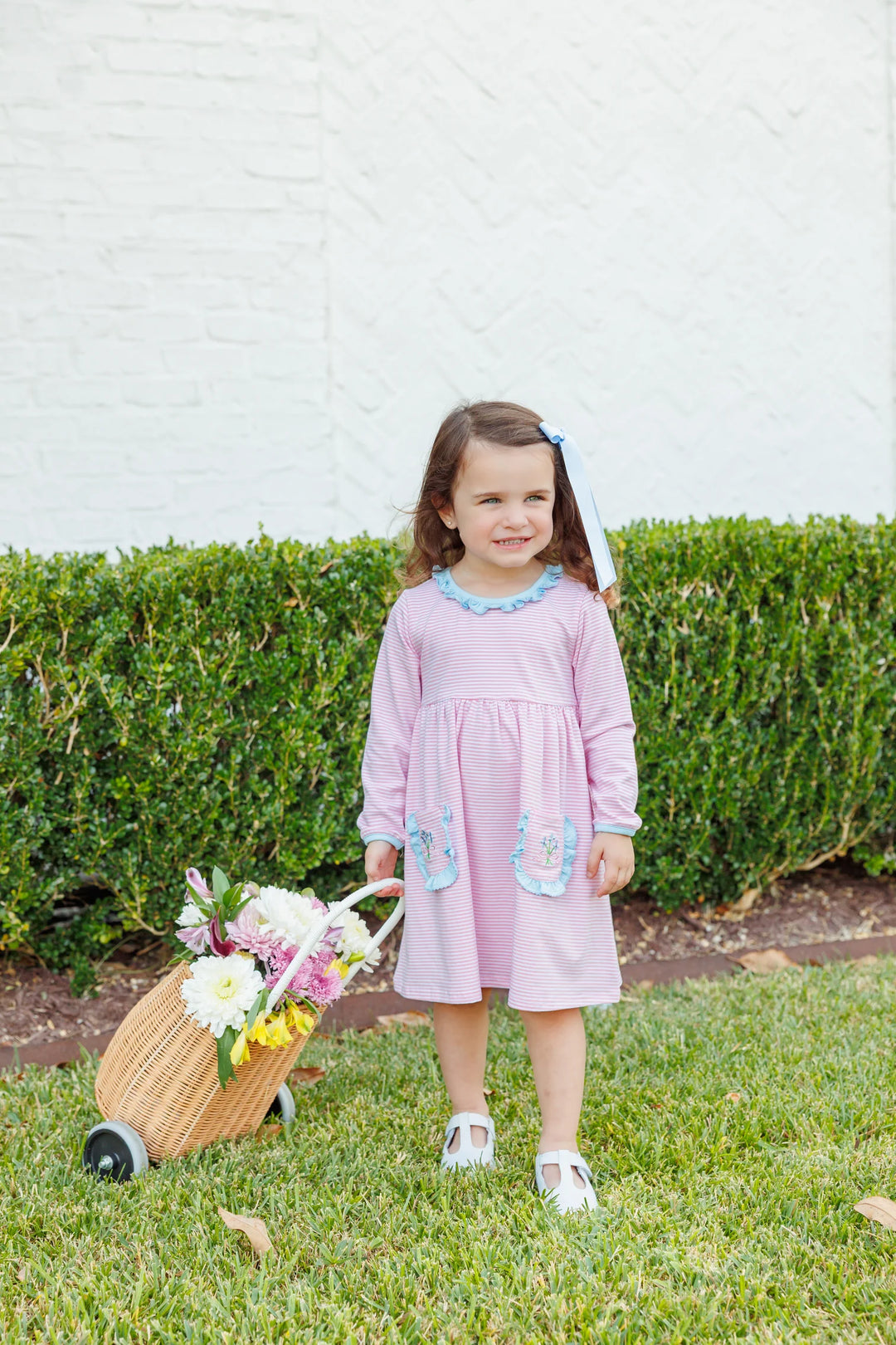 LITTLE GIRL WITH FLOWER BASKET WEARING SWEET FLOWER BOUQUET PINK STRIPED DRESS