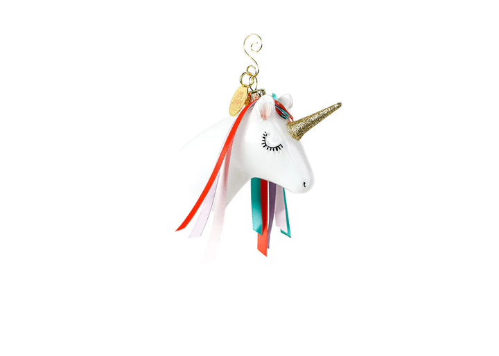 Unicorn-shaped ornament with colorful mane on a white background