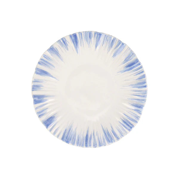 Round plate with blue and white abstract pattern on a white background