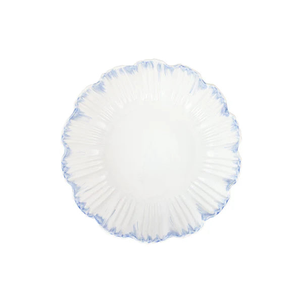 Round white cushion with blue trim on a white background