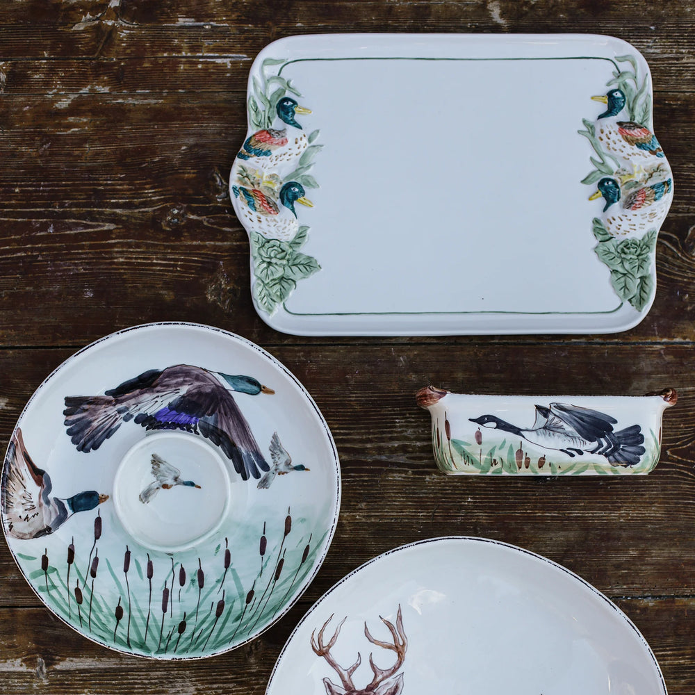 assorted mallard and goose serveware on table