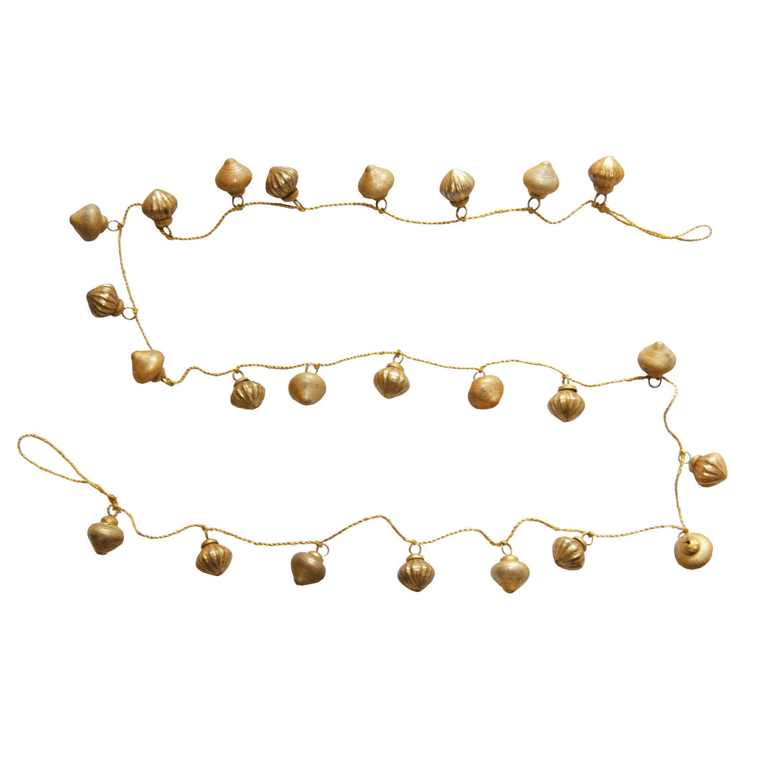 Gold decorative garland with small balls on a white background